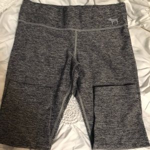 2 different pairs of capri leggings. 1 pink. 2. Idk